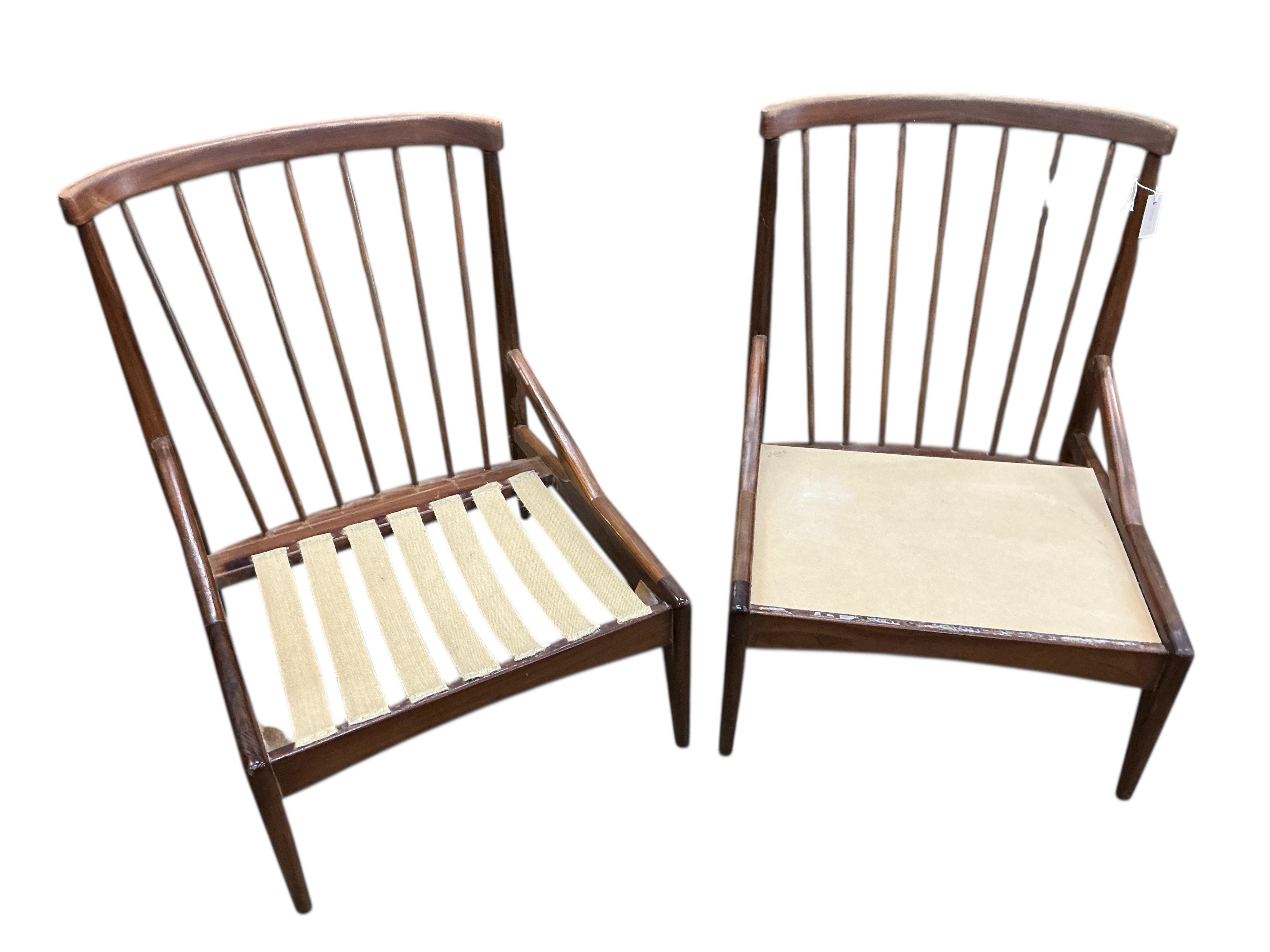Greaves and Thomas: A pair of mid century stick back armchairs, width 64cm, depth 64cm, height 80cm